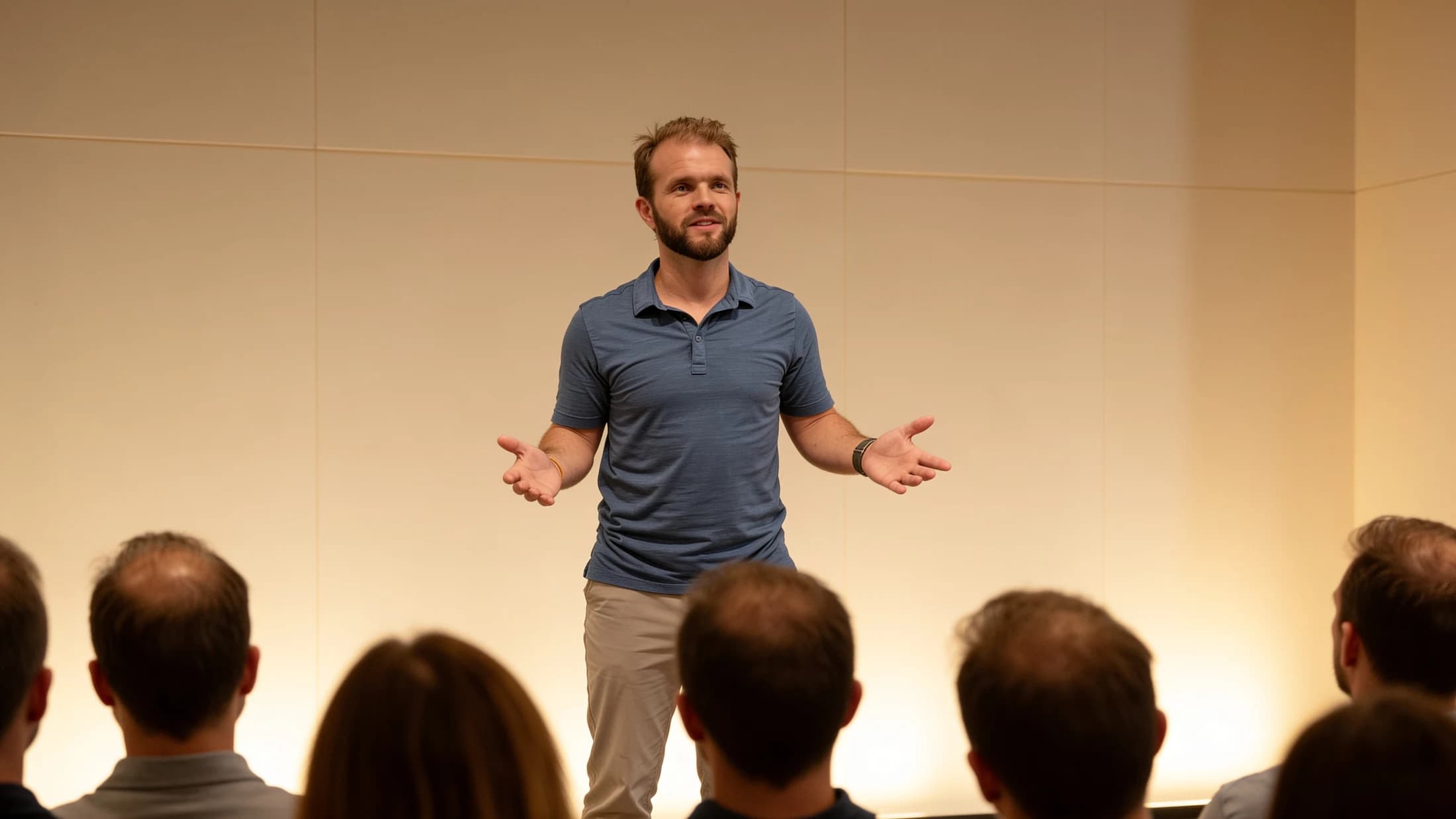 Taylor Frampton teaching from a stage